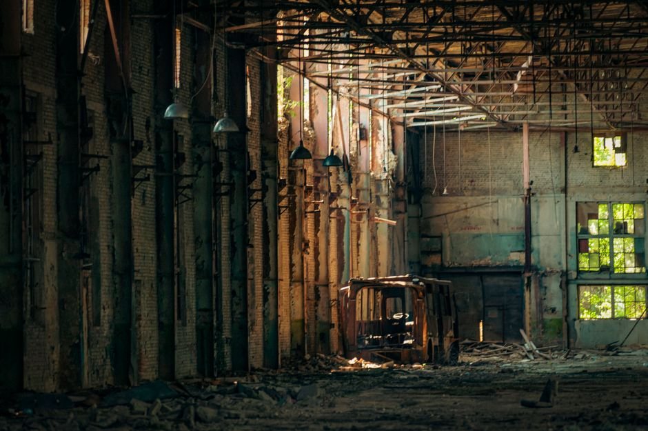 Damaged industrial building with Coca-Cola signage after Russian drone strike near Kyiv